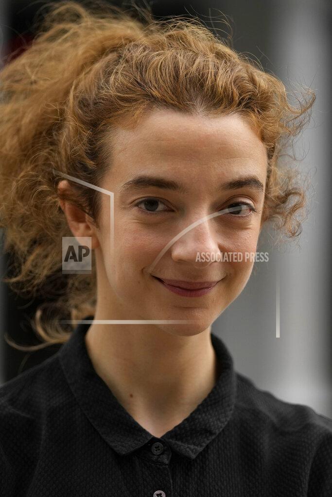 Frank Augstein Actress Patsy Ferran, star of the play Camp Siegfried, poses for a photographer in front of the Old Vic theatre in London, Friday, Sept. 10, 2021. London's Old Vic Theatre is reopening at full capacity for the first time since the pandemic began. The show is “Camp Siegfried,” American writer Bess Wohl's play about a summer camp for Nazis on New York's Long Island. It's based on a real-life camp in the 1930s that indoctrinated young German-Americans into the ideas of the Third Reich, and depicts two teenagers whose burgeoning relationship collides with the insidious ideology of Nazism. (AP Photo/Frank Augstein)