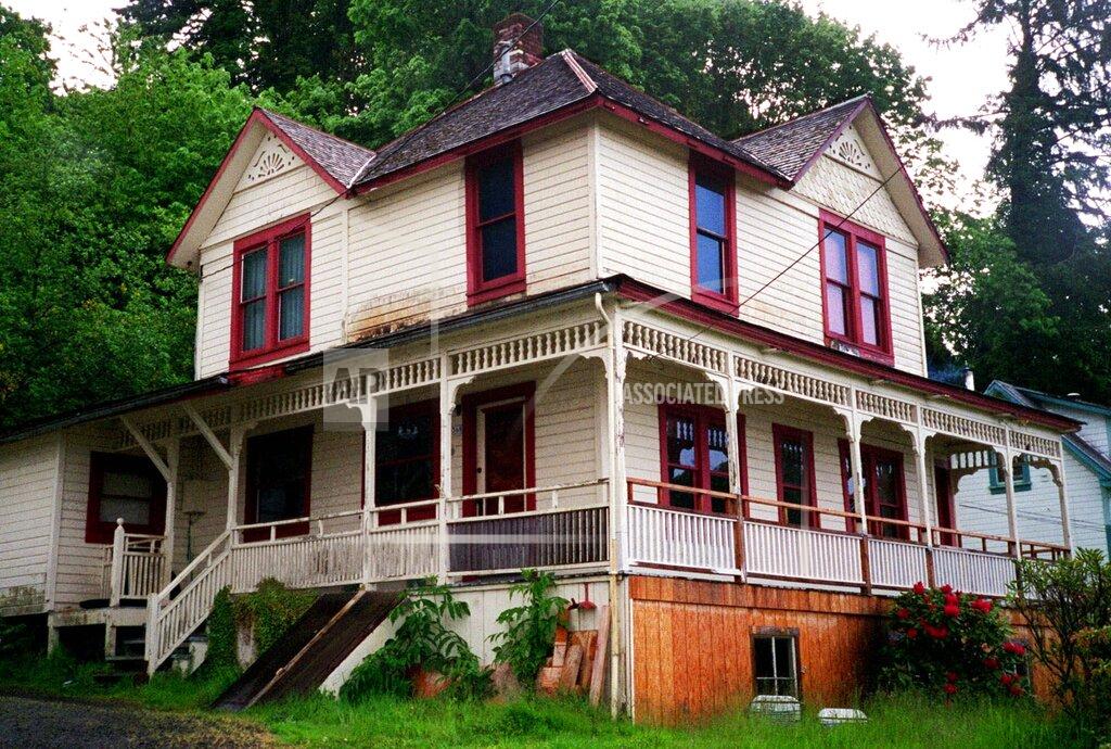 Stephanie Frith FILE - The house featured in the Steven Spielberg film "The Goonies" is seen in Astoria, Ore., on May 24, 2001. The Victorian home, built in 1896 with sweeping views of the Columbia River as it flows into the Pacific Ocean, is now for sale has been listed with an asking price of $1.7 million. Since the film was released in 1985, fans have flocked to the home, and the owner has long complained of constant crowds and trespassing. (AP Photo/Stepanie Firth, File)