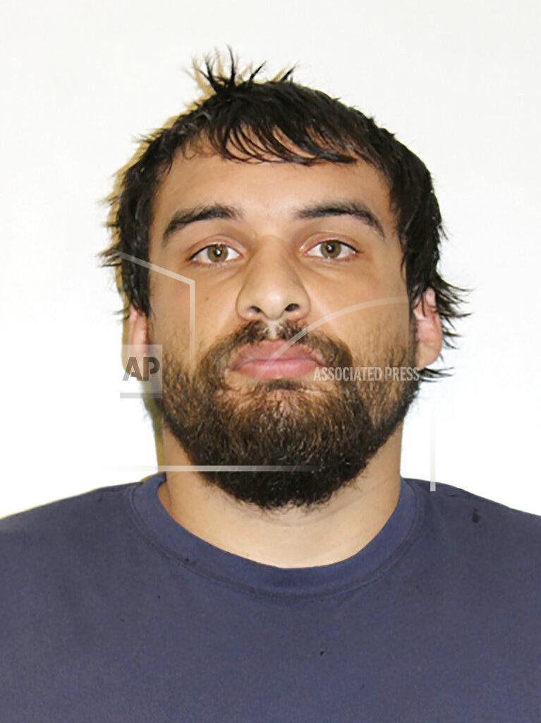 Uncredited In this Monday, Aug. 26, 2019, booking photo provided by the Todd County, Minn., Sheriff's Office is Dylan John Bennett. Bennett was booked into the Todd County Jail early Monday, after being arrested for second-degree murder at a hotel in Cancun, Mexico on Saturday. Barry and Carol Bennett, both 63, were found fatally shot last Wednesday at their home in Long Prairie, Minn,. Barry Bennett played 11 seasons in the NFL with the Saints, Jets, and Vikings. (Todd County Sheriff's Office via AP)