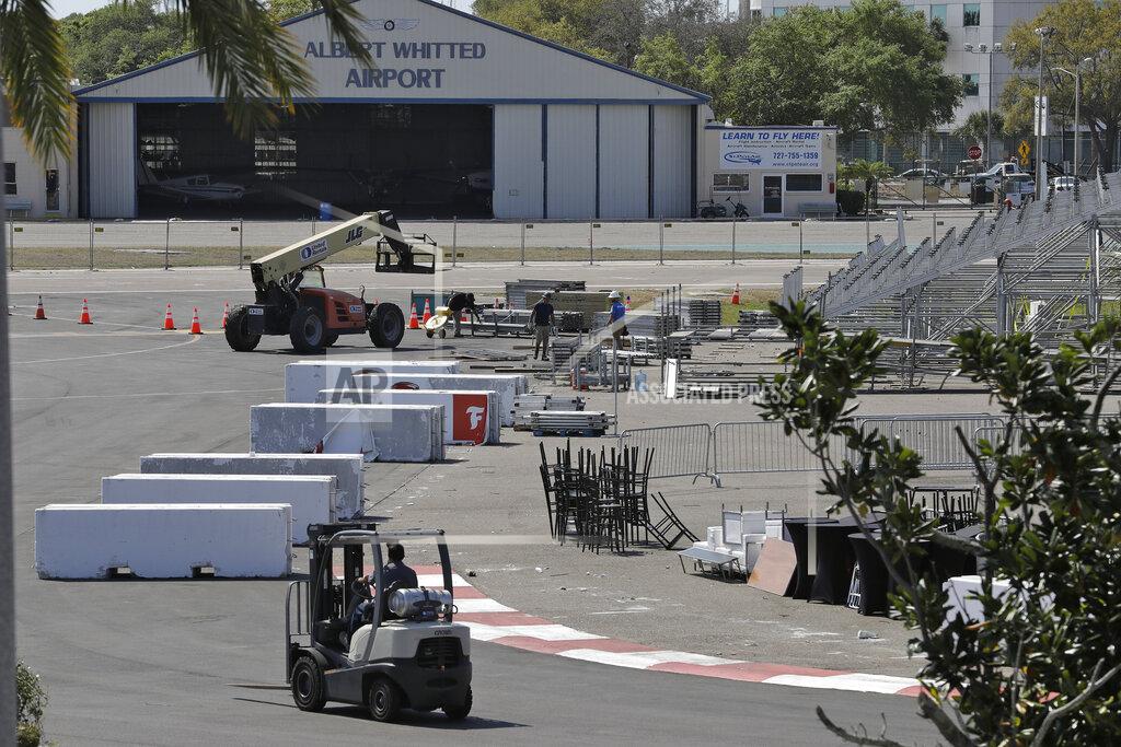 Chris O'meara Worker begin to dismantle the fans grandstand for the IndyCar Firestone Grand Prix of St. Petersburg auto race, Monday, March 16, 2020, in St. Petersburg, Fla. Race organizers canceled the event to help curb the spread of the coronavirus. (AP Photo/Chris O'Meara)
