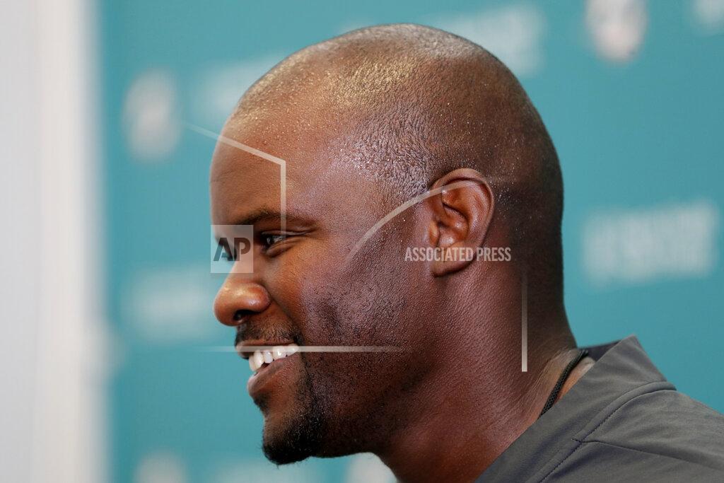 Miami Dolphins head coach Brian Flores talks with the news media during NFL football training camp, Friday, July 26, 2019, in Davie, Fla. (AP Photo/Lynne Sladky)