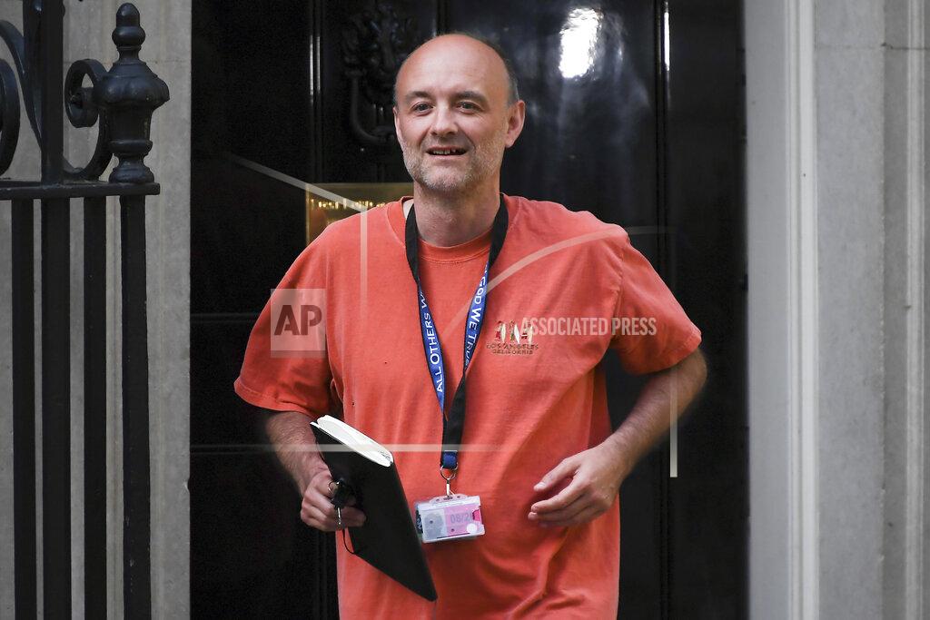 FILE - In this May 24, 2020 file photo, Britain's Prime Minister Boris Johnson's senior aid Dominic Cummings leaves 10 Downing Street, in London. The former top aide to British Prime Minister Boris Johnson ramped up his criticism of the government’s handling of the coronavirus on Wednesday, June 16, 2021 releasing private message exchanges in which Johnson appeared to brand his health minister “hopeless.” Dominic Cummings, who was Johnson’s most senior adviser until November, published a screenshot of WhatsApp exchanges, apparently with Johnson, discussing problems securing protective equipment and increasing coronavirus testing in March 2020. In one message, Johnson said Health Secretary Matt Hancock was “totally (expletive) hopeless.” Johnson’s office would neither confirm nor deny that the messages were genuine. (AP Photo/Alberto Pezzali, File)