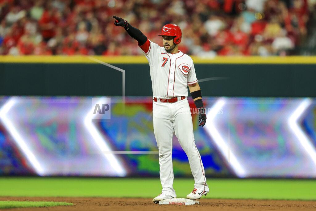 Aaron Doster Cincinnati Reds' Eugenio Suarez points to teammates after hitting an RBI-double during the seventh inning of a baseball game against the St. Louis Cardinals in Cincinnati, Friday, July 23, 2021. (AP Photo/Aaron Doster)