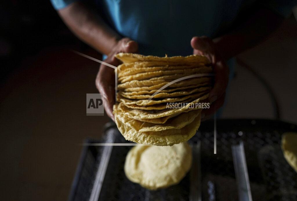 Fernando Llano A worker packages tortillas to sell for 20 Mexican Pesos per kilogram, about one dollar, at a tortilla factory in Mexico City, Monday, May 9, 2022. Almost a year ago the same tortilla factory used to sell a kilo of tortillas for 10 Mexican Pesos. (AP Photo/Fernando Llano)