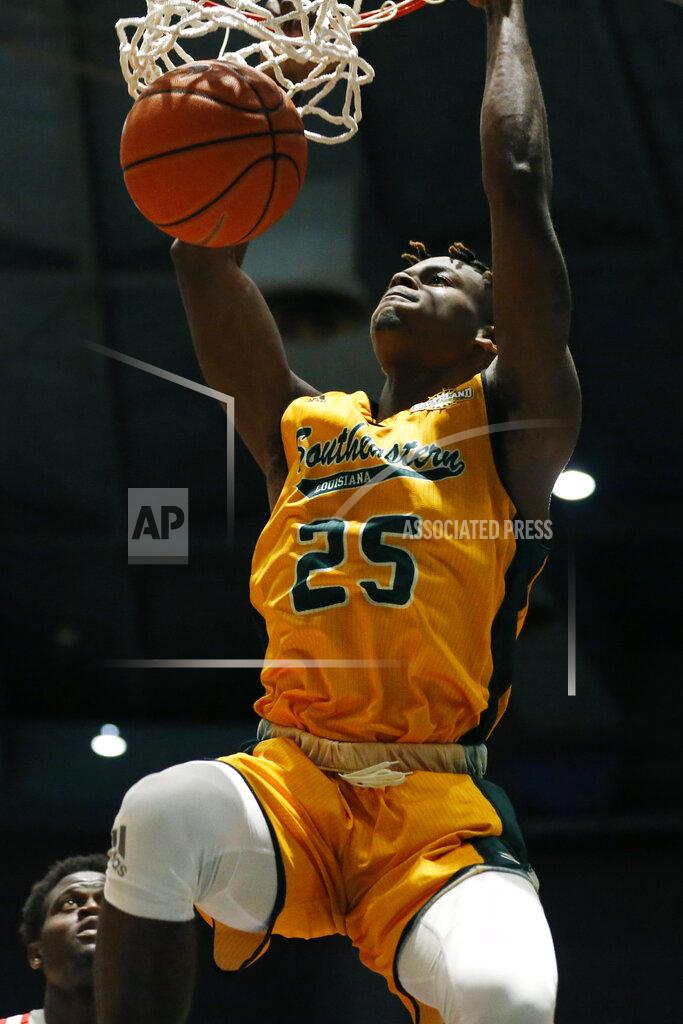 Rogelio V. Solis Southeastern Louisiana forward Ty Brewer (25) hangs on the basket after dunking against Mississippi during the second half of an NCAA college basketball game, Saturday, Dec. 21, 2019, in Jackson, Miss. Mississippi won 83-76.(AP Photo/Rogelio V. Solis)