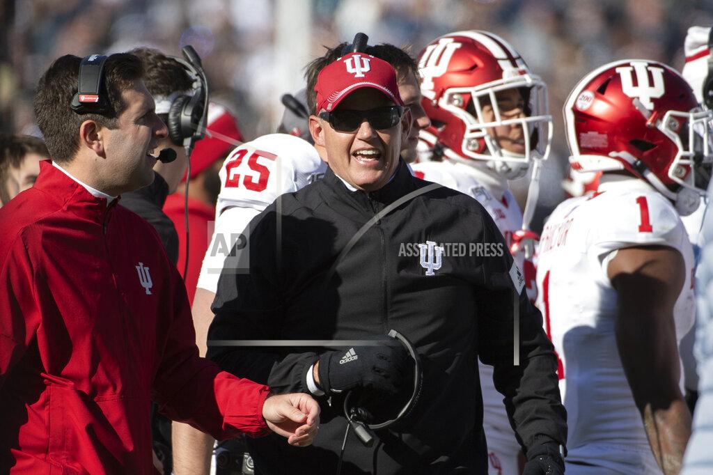FILE - In this Nov. 16, 2019, file photo, Indiana coach Tom Allen watches the second quarter of the team's NCAA college football game against Penn State in State College, Pa. The Big Ten and Pac-12 became the first Power Five conferences to cancel their fall football seasons because of concerns about COVID-19. The Big Ten said it hopes to compete in the spring, and the Pac-12 pushed even basketball back to Jan. 1. “My heart breaks for our players. I couldn’t be prouder of the commitment and focus they have demonstrated from the start of this pandemic," Allen said of the Big Ten's decision Tuesday, Aug. 11. (AP Photo/Barry Reeger, File)