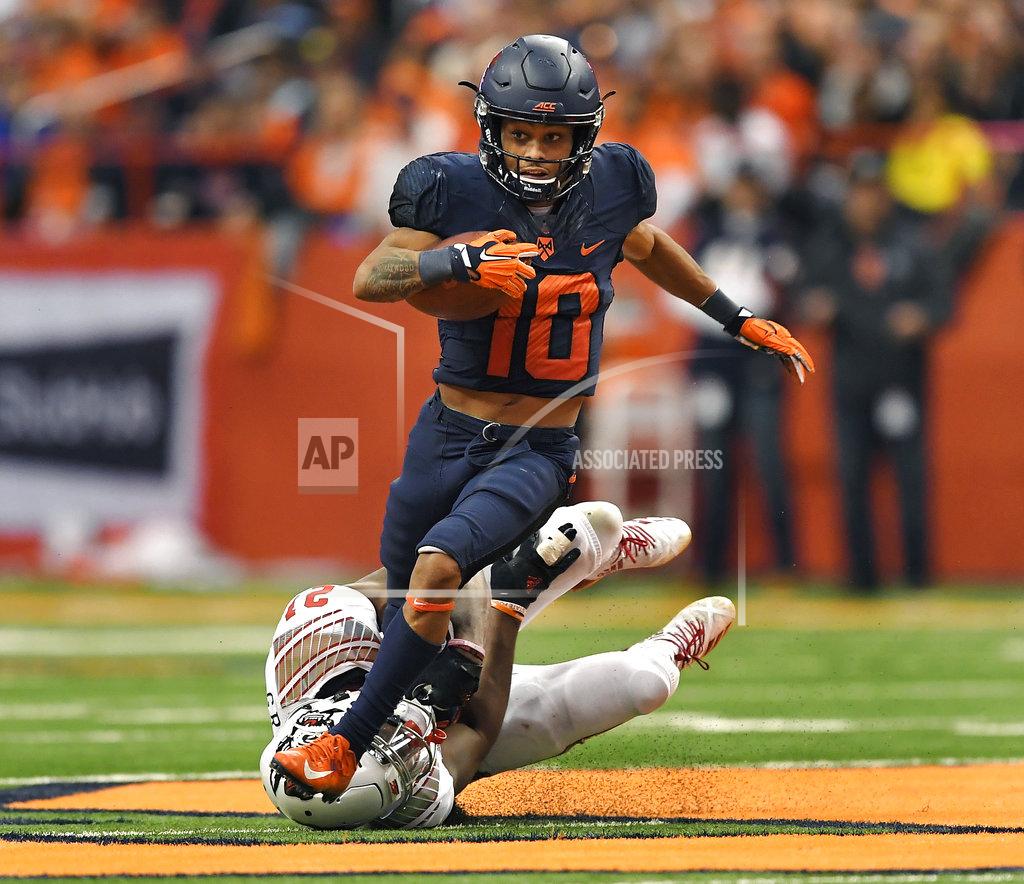 Adrian Kraus Syracuse wide receiver Sean Riley, top, tries to break the grasp of North Carolina State defensive back Stephen Griffin after a reception during the second half of an NCAA college football game in Syracuse, N.Y., Saturday, Oct. 27, 2018. (AP Photo/Adrian Kraus)