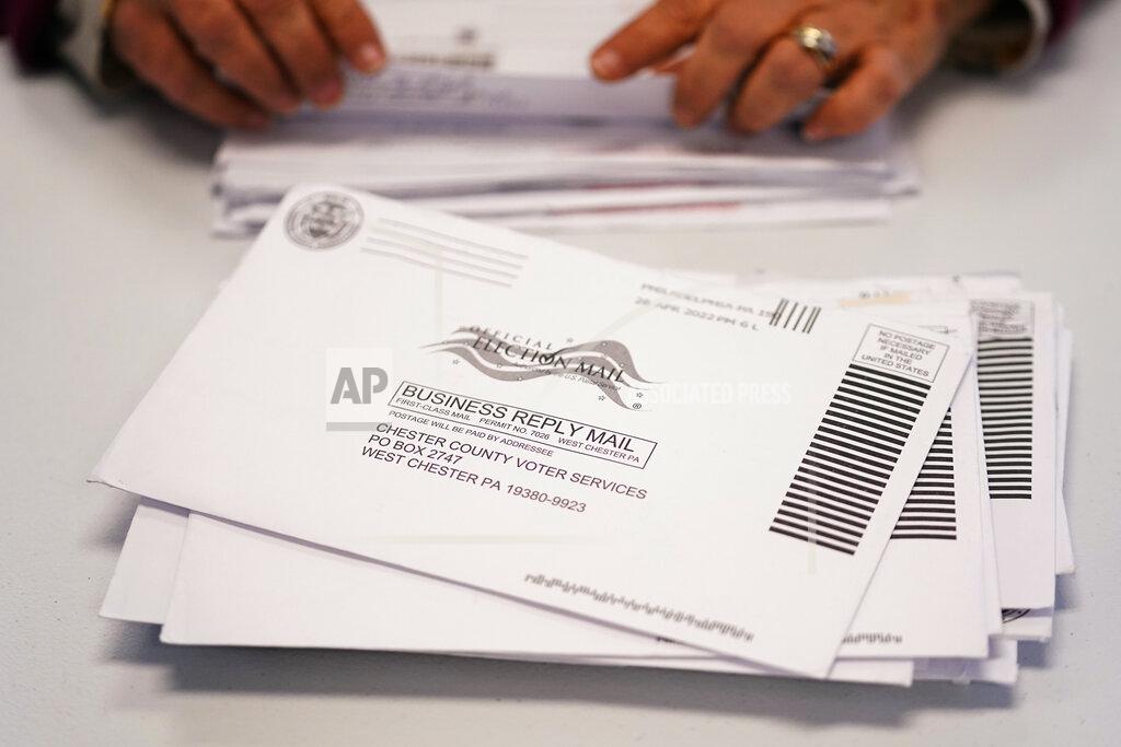 Matt Slocum Election worker Monica Ging processes ballots for the Pennsylvania primary election at the Chester County Voter Services office, Thursday, May 19, 2022, in West Chester, Pa. (AP Photo/Matt Slocum)