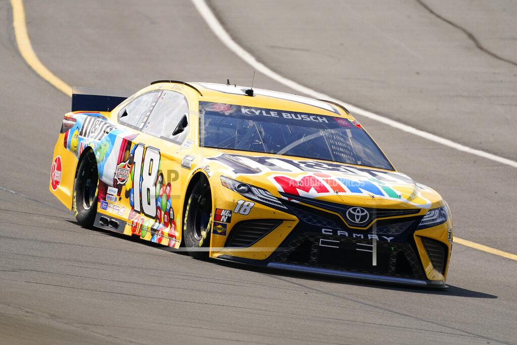 Matt Slocum Kyle Busch (18) goes through turn one during a NASCAR Cup Series auto race at Pocono Raceway, Sunday, June 27, 2021, in Long Pond, Pa. Busch won the race. (AP Photo/Matt Slocum)