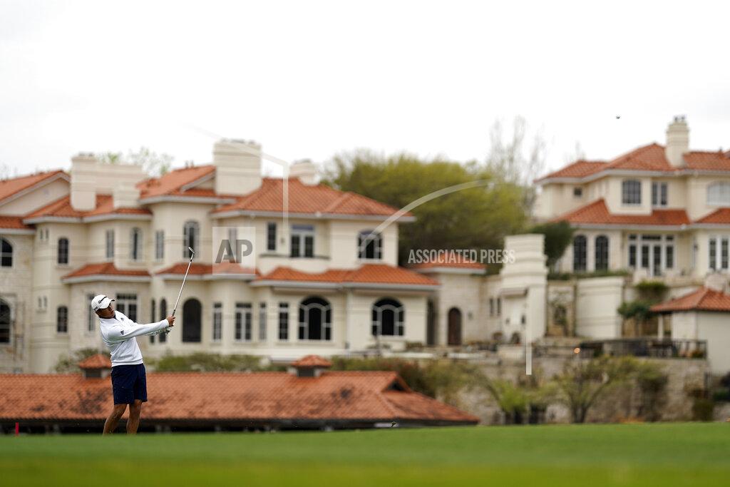 David J. Phillip Collin Morikawa hits his approach shot to the 12th hole during a practice round for the Dell Technologies Match Play Championship golf tournament Monday, March 22, 2021, in Austin, Texas. (AP Photo/David J. Phillip)