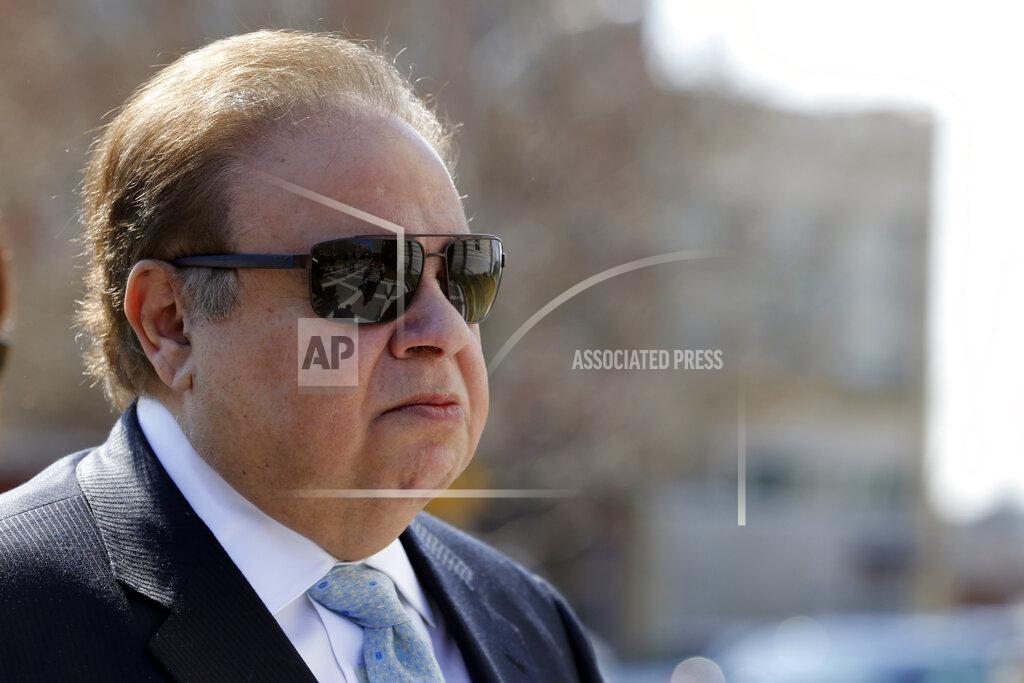 Julio Cortez FILE - In this April 2, 2015 file photo, Dr. Salomon Melgen arrives at the Martin Luther King Jr. Federal Courthouse for his arraignment in Newark, N.J. The prominent Florida eye doctor, convicted of defrauding Medicare out of $73 million, got out of prison early on Wednesday, Jan. 20, 2021, after former President Donald Trump commuted his sentence just hours before his term ended. (AP Photo/Julio Cortez, File)