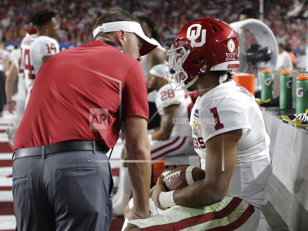 Oklahoma head coach Lincoln Riley, left, talks to quarterback Kyler Murray (1), during the first half of the Orange Bowl NCAA college football game against Alabama, Saturday, Dec. 29, 2018, in Miami Gardens, Fla. (AP Photo/Lynne Sladky)