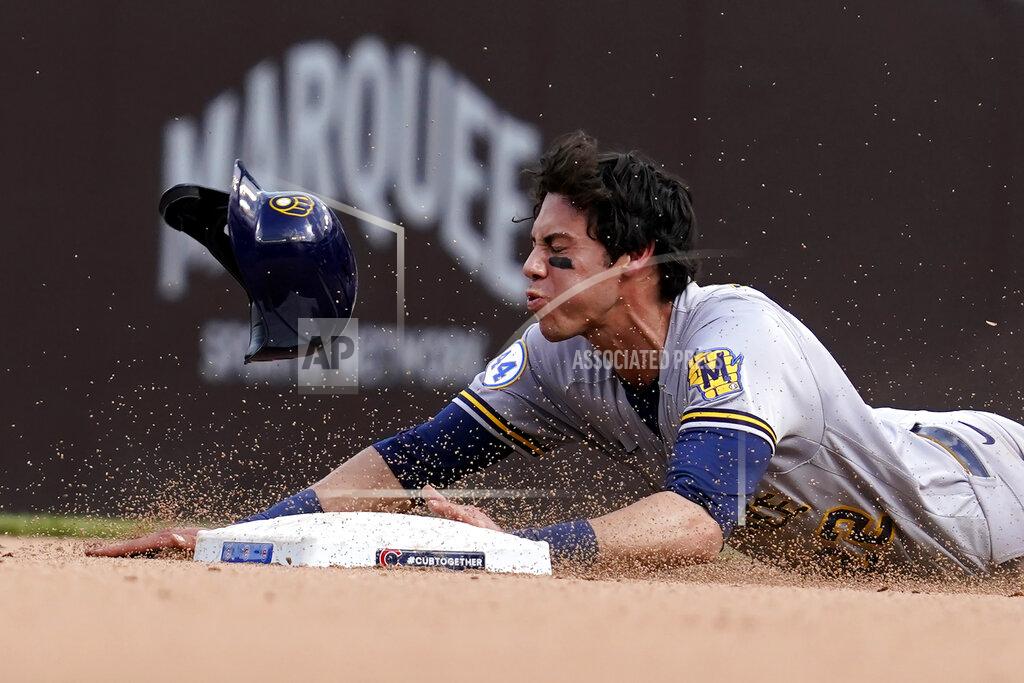 Nam Y. Huh Milwaukee Brewers' Christian Yelich steals second base during the eighth inning of a baseball game against the Chicago Cubs in Chicago, Wednesday, April 7, 2021. (AP Photo/Nam Y. Huh)