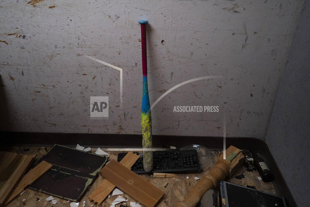 Jae C. Hong A baseball bat is propped against a wall in a rage room after clients smashed objects into pieces at Smash RX LLC in Westlake Village, Calif., Friday, Feb. 5, 2021. Meditation, yoga, Pilates, they may be fine for some people. But after nearly a year in COVID-19 isolation, some people just want to grab a sledgehammer and smash everything in sight. Thankfully, for them there are now two "rage rooms" located in the Los Angeles suburb of Westlake Village, where they can do just that and not get in trouble. (AP Photo/Jae C. Hong)