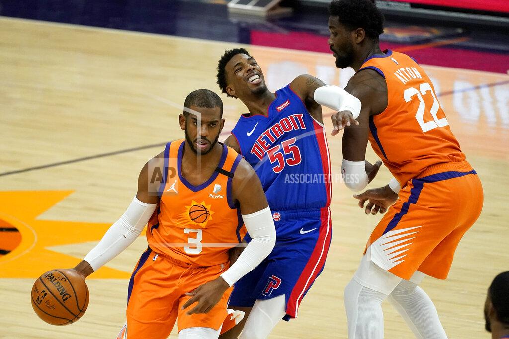 Matt York Phoenix Suns guard Chris Paul (3) drives as Detroit Pistons guard Delon Wright (55) is blocked by center Deandre Ayton (22) during the second half of an NBA basketball game, Friday, Feb. 5, 2021, in Phoenix. (AP Photo/Matt York)
