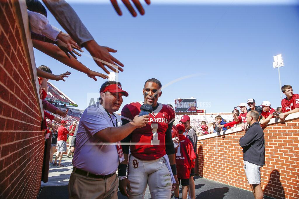 Alonzo Adams Oklahoma quarterback Jalen Hurts (1) talks to a reporter following an NCAA college football game against West Virginia in Norman, Okla., Saturday, Oct. 19, 2019. Oklahoma won 52-14. (AP Photo/Alonzo Adams)