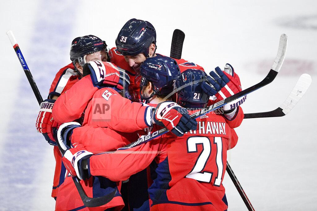 Nick Wass Washington Capitals defenseman Zdeno Chara (33) celebrates his goal with right wing Garnet Hathaway (21) and others during the first period of an NHL hockey game against the Boston Bruins, Monday, Feb. 1, 2021, in Washington. (AP Photo/Nick Wass)