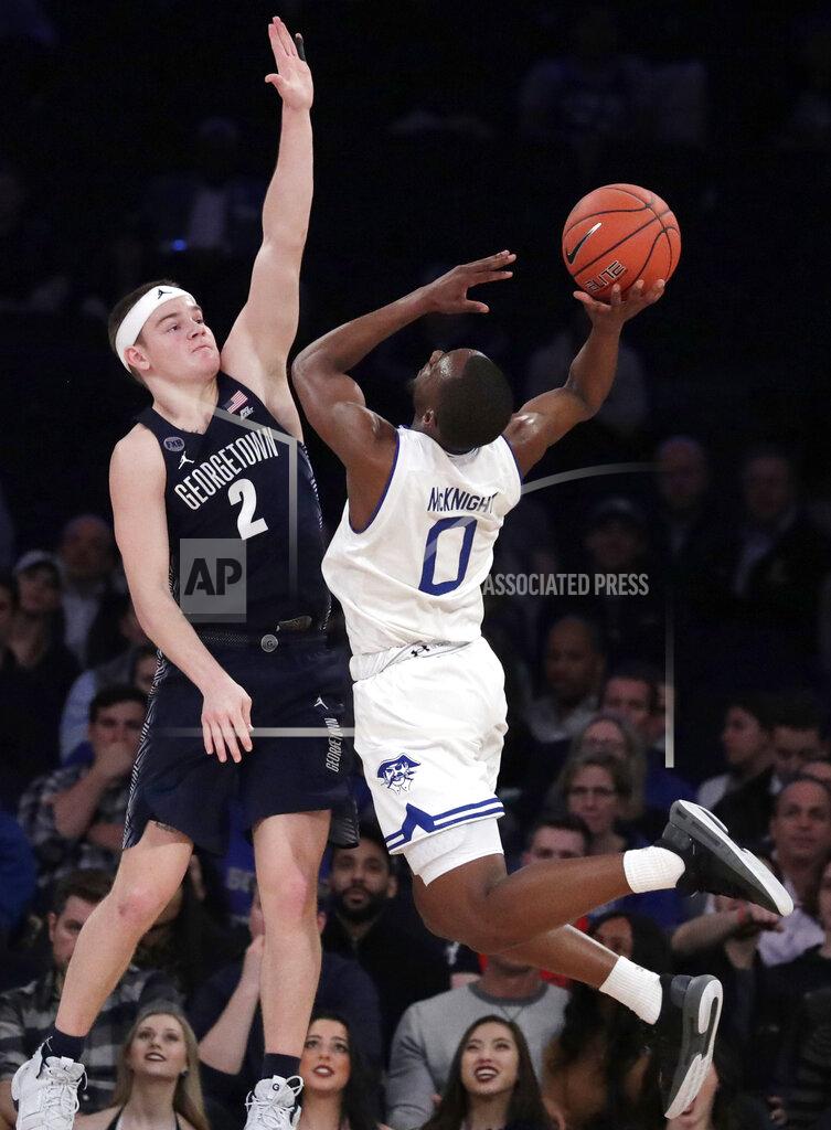 Julio Cortez Seton Hall guard Quincy McKnight (0) goes up for a shot against Georgetown guard Mac McClung (2) during the second half of an NCAA college basketball game in the Big East men's tournament, Thursday, March 14, 2019, in New York. Seton Hall won 73-57. (AP Photo/Julio Cortez)