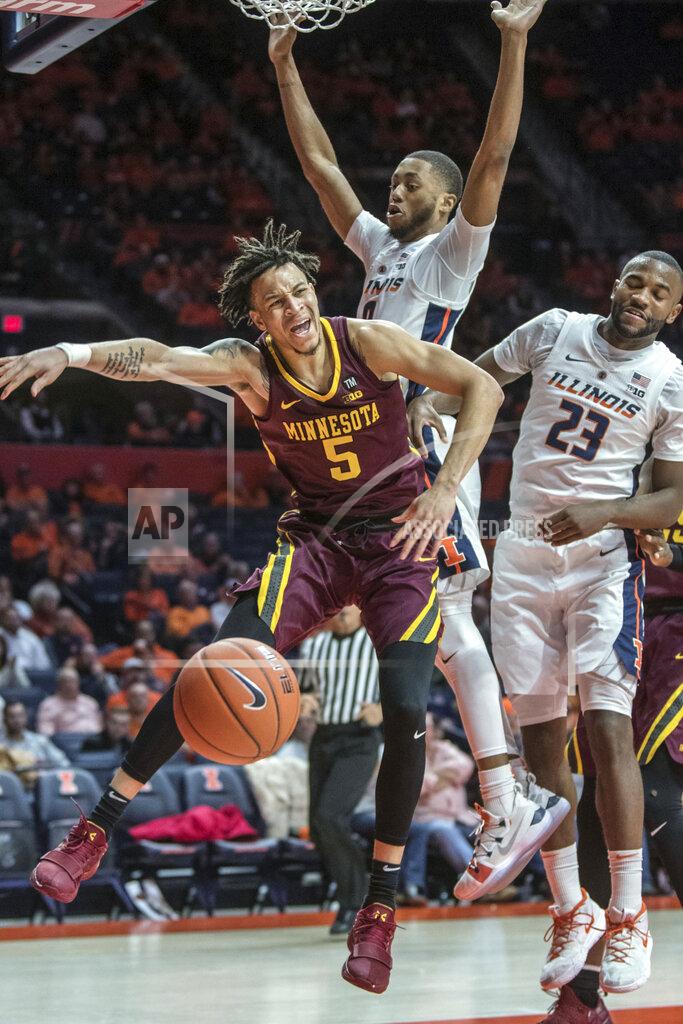 Rick Danzl Minnesota guard Amir Coffey (5) has the ball stripped near Illinois guards Alan Griffin (0) and Aaron Jordan (23) during the second half of an NCAA college basketball game in Champaign, Ill., Wednesday, Jan. 16, 2019. (AP Photo/Rick Danzl),