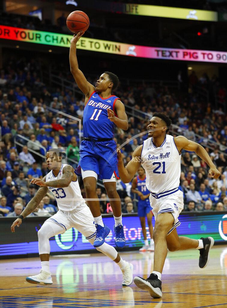 Noah K. Murray DePaul's Charlie Moore (11) goes to the basket against Seton Hall's Shavar Reynolds (33) and Ike Obiagu (21) during the first half of an NCAA college basketball game Wednesday, Jan. 29, 2020 in Newark, N.J. (AP Photo/Noah K. Murray)