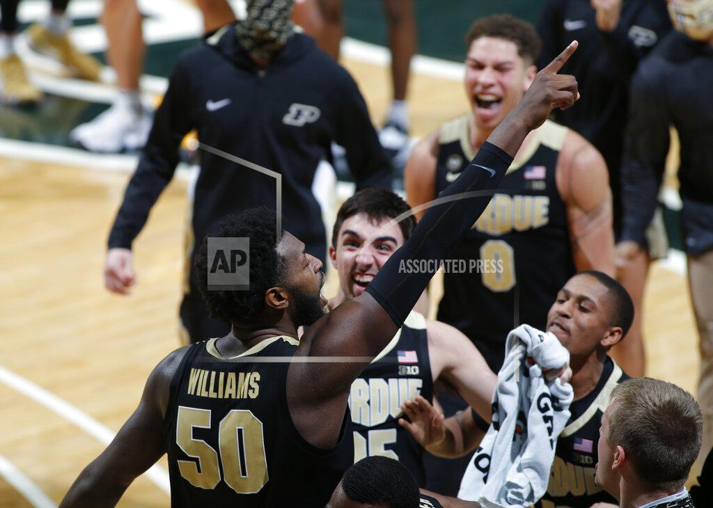 Al Goldis Purdue's Trevion Williams, left, celebrates with teammates following an NCAA college basketball game against Michigan State, Friday, Jan. 8, 2021, in East Lansing, Mich. Purdue won 55-54. (AP Photo/Al Goldis)