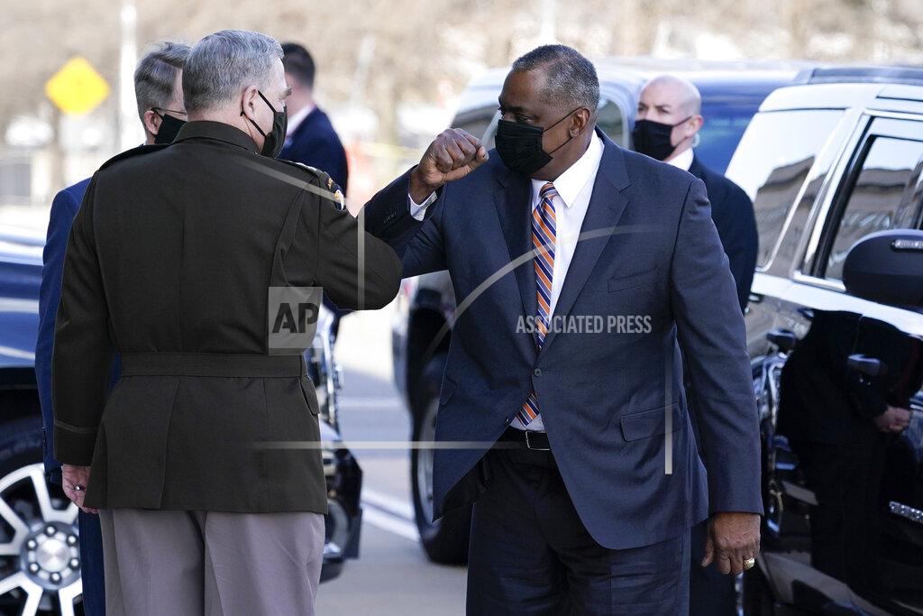 Alex Brandon Defense Secretary Lloyd Austin, right, greets Chairman of the Joint Chiefs of Staff Mark Milley as he arrive at the Pentagon, Friday, Jan. 22, 2021, in Washington. (AP Photo/Alex Brandon)