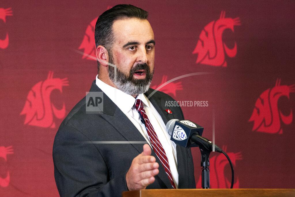 FILE - In this Thursday, Jan. 16, 2020, file photo, new Washington State head football coach Nick Rolovich speaks during an NCAA college football news conference after being officially introduced in Pullman, Wash. Normally, in March, college football teams would be preparing for the upcoming season. Because of the new coronavirus pandemic, coaches are trying to figure out how to recreate some of what has been lost. Rolovich said the Cougars will continue to learn their new offensive and defensive systems...online. (Pete Caster/Lewiston Tribune via AP, File)/