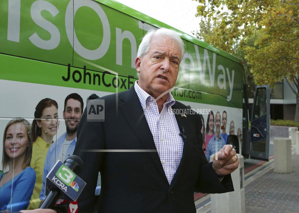 Rich Pedroncelli FILE - In this Nov. 1, 2018, file photo, Republican gubernatorial candidate John Cox talks to reporters before beginning a statewide bus tour in Sacramento, Calif. California Gov. Gavin Newsom is facing a possible recall election as the nation's most populous state struggles to emerge from the coronavirus crisis. Newsom's challenging year has already encouraged Republicans who have signaled they are likely candidates, including former San Diego Mayor Kevin Faulconer and Newsom's 2018 rival, businessman Cox. (AP Photo/Rich Pedroncelli, File)