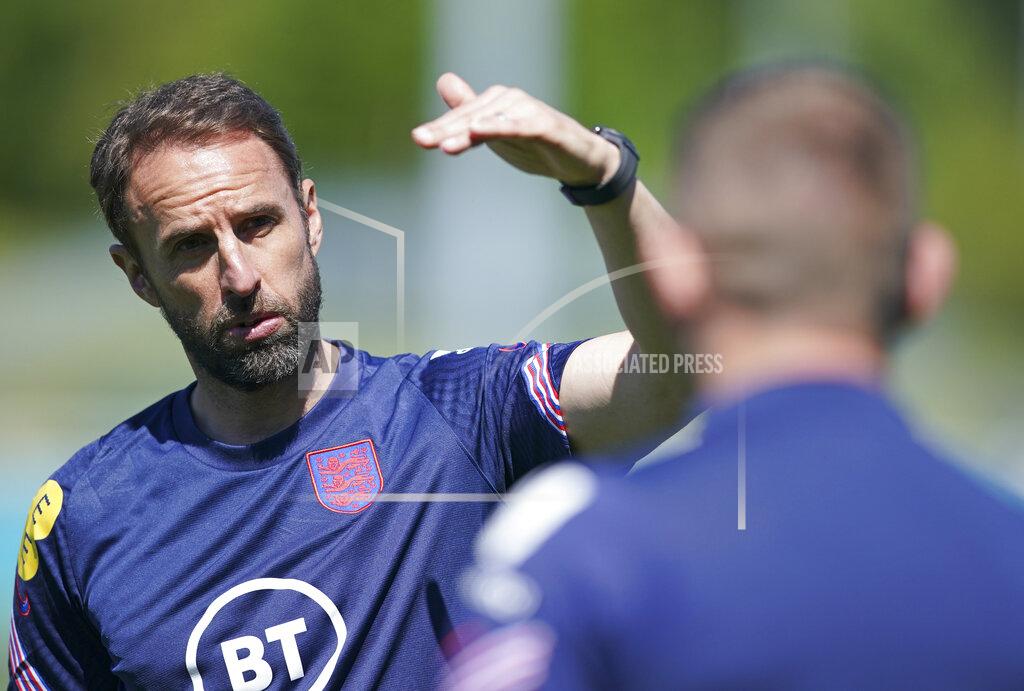 Dave Thompson England's manager Gareth Southgate gestures during an open training session at St. George's Park, Burton-upon-Trent, Wednesday June 9, 2021. The Euro 2020 soccer championship gets underway on Friday June 11 and is being played in 11 host cities across 11 countries. The event was delayed by one year after being postponed in 2020 due to the COVID-19 pandemic. (AP Photo/Dave Thompson)