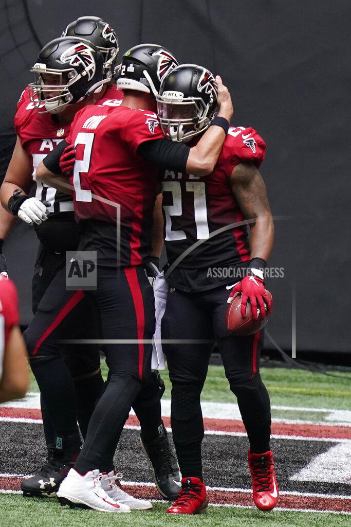 Brynn Anderson Atlanta Falcons quarterback Matt Ryan (2) congratulates Atlanta Falcons running back Todd Gurley after Gurley scored a touchdown against the Detroit Lions during the first half of an NFL football game, Sunday, Oct. 25, 2020, in Atlanta. (AP Photo/Brynn Anderson)