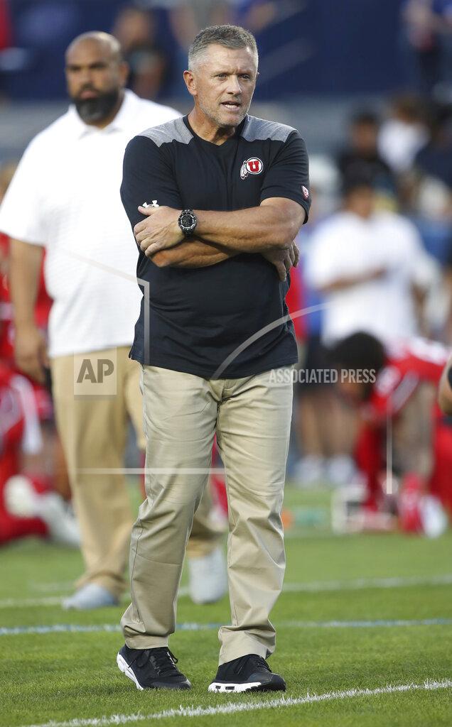 George Frey Utah coach Kyle Whittingham watches his team warm up for an NCAA college football game against BYU, Thursday, Aug. 29, 2019, in Provo, Utah. (AP Photo/George Frey)
