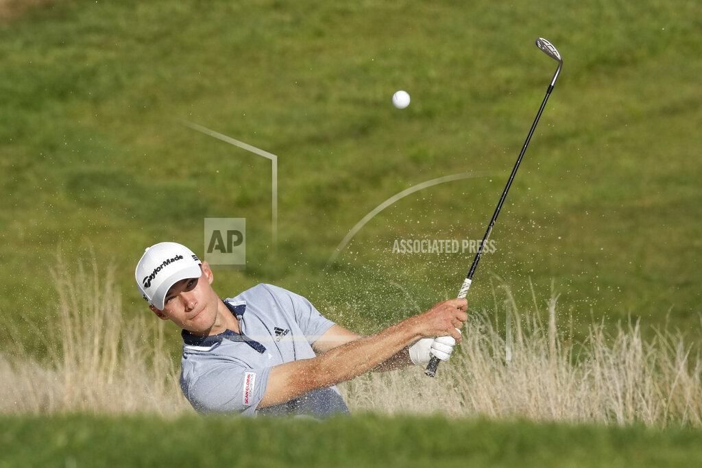 Andrew Medichini Nicolai Hojgaard hits a bunker shot during the fourth stage of the Italian Open golf tournament he just won, in Guidonia, in the outskirts of Rome, Sunday, Sept. 5, 2021. The Italian Open took place on the redesigned Marco Simone course just outside Rome that will host the 2023 Ryder Cup.(AP Photo/Andrew Medichini)