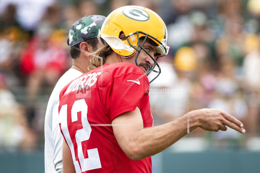 Samantha Madar Green Bay Packers quarterback Aaron Rodgers (12) motions to quarterback Jordan Love during an NFL football training camp Monday, Aug. 1, 2022, in Ashwaubenon, Wis. (Samantha Madar/The Post-Crescent via AP)