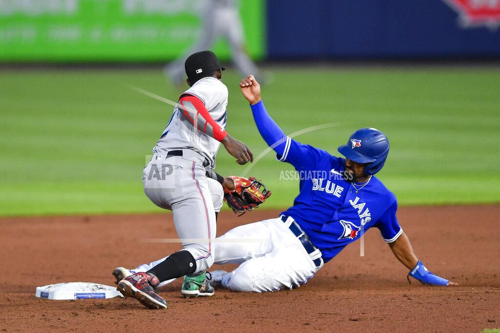 Adrian Kraus Toronto Blue Jays' Marcus Semien (10) beats the tag at second by Miami Marlins shortstop Jazz Chisholm Jr. (2) on a groundout by Bo Bichette during the fifth inning of a baseball game in Buffalo, N.Y., Tuesday, June 1, 2021. (AP Photo/Adrian Kraus)