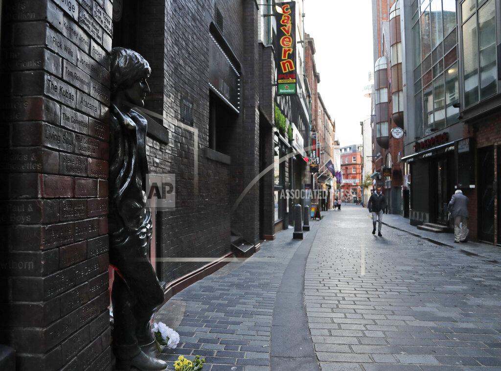 Frank Augstein The Cavern Quarter is almost empty as new anti-coronavirus measures are set to come into force in Liverpool, England, Wednesday, Oct. 14, 2020. (AP Photo/Frank Augstein)