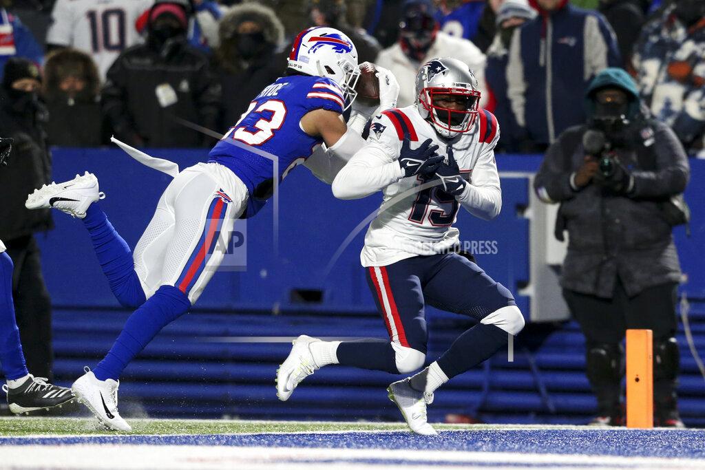 Joshua Bessex Buffalo Bills safety Micah Hyde (23) makes an interception against New England Patriots wide receiver Nelson Agholor (15) during the first half of an NFL wild-card playoff football game, Saturday, Jan. 15, 2022, in Orchard Park, N.Y. (AP Photo/Joshua Bessex)