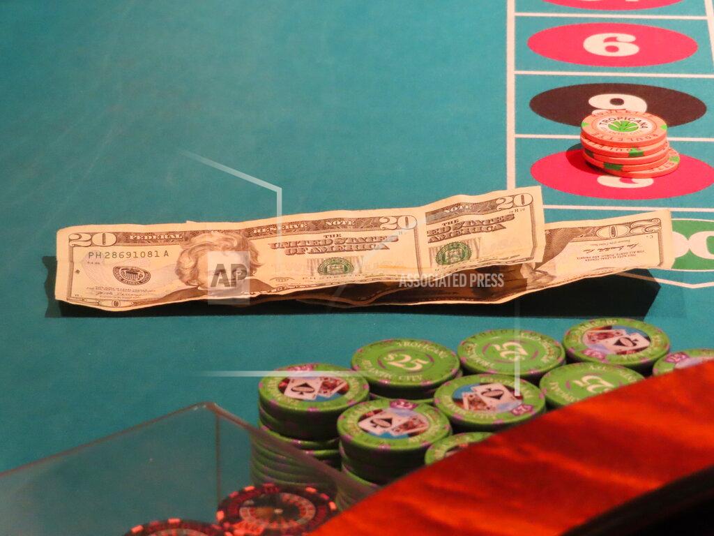 Wayne Parry Money sits on the table during a roulette game at the Tropicana casino in Atlantic City, N.J., on May 12, 2022. Figures released by New Jersey gambling regulators on May 23, 2022, show the Atlantic City casinos collectively posted a gross operating profit of $155.6 million in the first quarter of this year. (AP Photo/Wayne Parry)