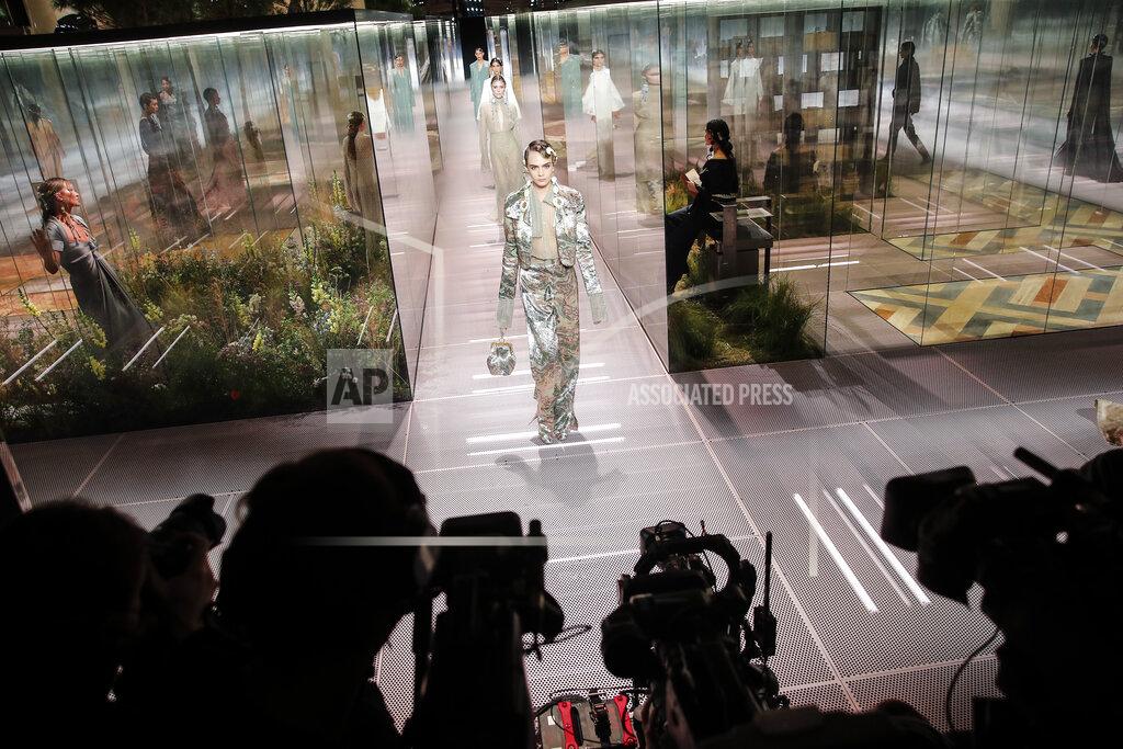Francois Mori FILE - In this Jan. 27, 2021 file photo, model Cara Delevingne wears a creation for Fendi's Spring-Summer 2021 Haute Couture fashion collection presented in Paris. The pandemic has torn a multibillion-dollar bite out of the fabric of Europe's luxury industry, stopped runway shows and forced brands to show their designs digitally instead. Now, amid hopes of a return to near-normality by the year’s end, the industry is asking what fashion will look like as it dusts itself and struggles to its well-heeled feet again. (AP Photo/Francois Mori, File)