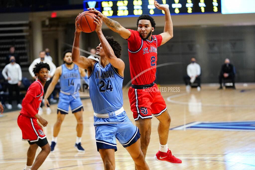 Matt Slocum Villanova's Jeremiah Robinson-Earl (24) tries to get a shot past St. John's Julian Champagnie (2) during the first half of an NCAA college basketball game, Tuesday, Feb. 23, 2021, in Villanova, Pa. (AP Photo/Matt Slocum)