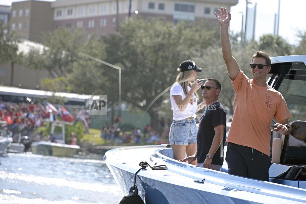 Phelan Ebenhack Tampa Bay Buccaneers NFL football quarterback Tom Brady waves to fans as he celebrates their Super Bowl 55 victory over the Kansas City Chiefs with a boat parade in Tampa, Fla., Wednesday, Feb. 10, 2021. (AP Photo/Phelan Ebenhack)