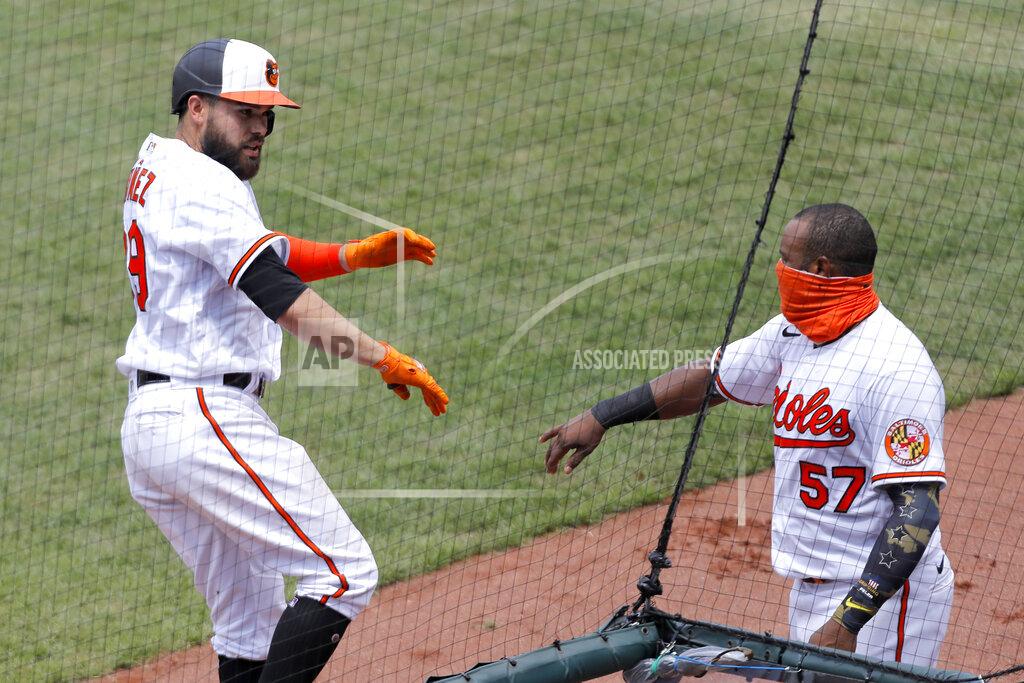Julio Cortez Baltimore Orioles' Renato Nunez, left, is greeted near the dugout by Hanser Alberto (57) after hitting a solo home run off Tampa Bay Rays relief pitcher Yonny Chirinos during the third inning of a baseball game, Sun, Aug. 2, 2020, in Baltimore. (AP Photo/Julio Cortez)