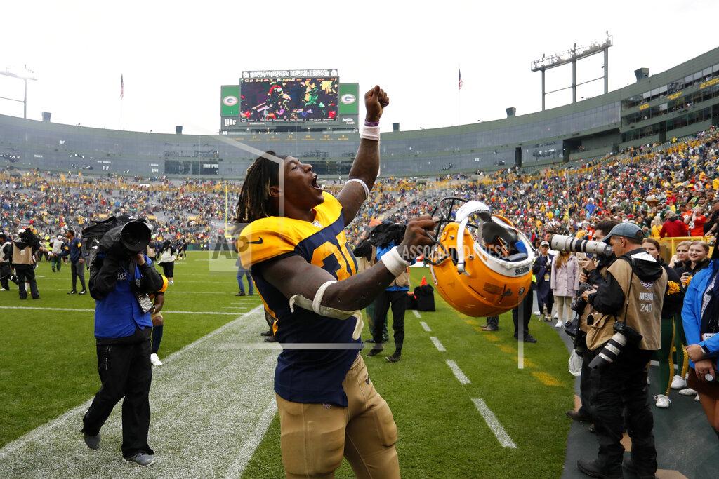 Matt Ludtke Green Bay Packers running back Jamaal Williams celebrates as he walks off the field following a 27-16 victory over the Denver Broncos in an NFL football game Sunday, Sept. 22, 2019, in Green Bay, Wis. (AP Photo/Matt Ludtke)