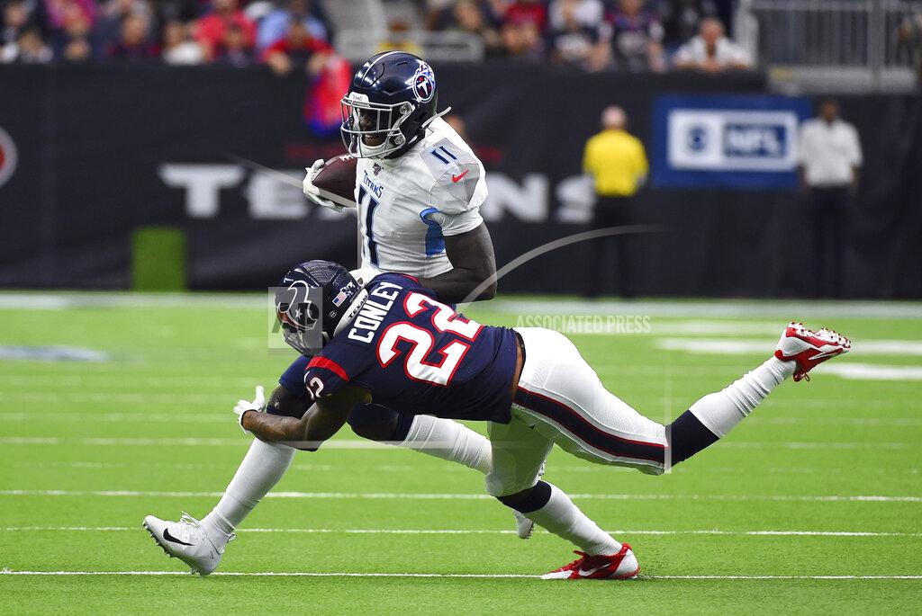 Tennessee Titans wide receiver A.J. Brown (11) is tackled by Houston Texans cornerback Gareon Conley (22) during the first half of an NFL football game Sunday, Dec. 29, 2019, in Houston. (AP Photo/Eric Christian Smith)