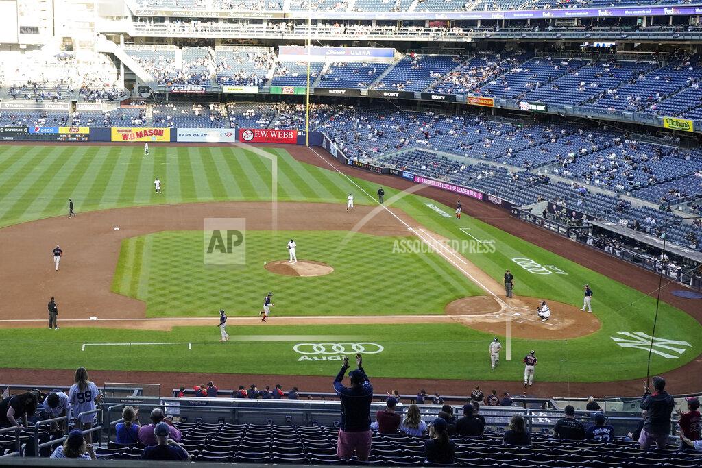Frank Franklin Ii Fans cheer as Boston Red Sox's Rafael Devers runs the bases after hitting a three-run home run during the first inning of a baseball game against the New York Yankees, Friday, June 4, 2021, in New York. (AP Photo/Frank Franklin II)
