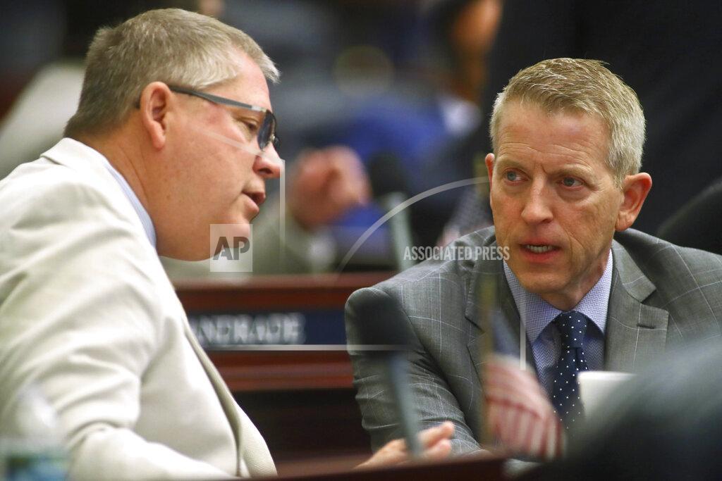 Phil Sears Rep. Chuck Brannan III, R-Macclenny, confers with Rep. Paul Renner, R-Palm Coast, as a bill titled CS/SB 2-D: Property Insurance is discussed in the Florida House of Representatives, Wednesday, May 25, 2022, at the Capitol in Tallahassee, Fla. (AP Photo/Phil Sears)