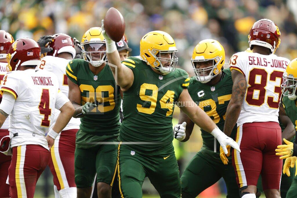 Matt Ludtke Green Bay Packers' Dean Lowry celebrates a fumble recovery during the second half of an NFL football game against the Washington Football Team Sunday, Oct. 24, 2021, in Green Bay, Wis. (AP Photo/Matt Ludtke)