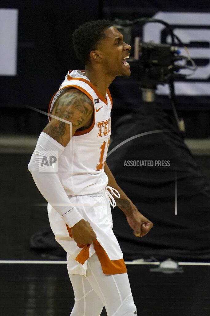Orlin Wagner Texas guard Jase Febres celebrates a three-point basket during the first half of an NCAA college basketball game against Texas Tech in the quarterfinal round of the Big 12 men's tournament in Kansas City, Mo., Thursday, March 11, 2021. (AP Photo/Orlin Wagner)