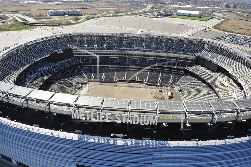 Ted Shaffrey FILE - This is an April 6, 2020, file photo showing an empty MetLife Stadium in East Rutherford, N.J. As contingency plans are made for playing in empty stadiums, or pushing back the schedule _ and the Super Bowl, perhaps even beyond February _ or even for games at neutral sites, rest assured the NFL has no plans to not play. (AP Photo/Ted Shaffrey)
