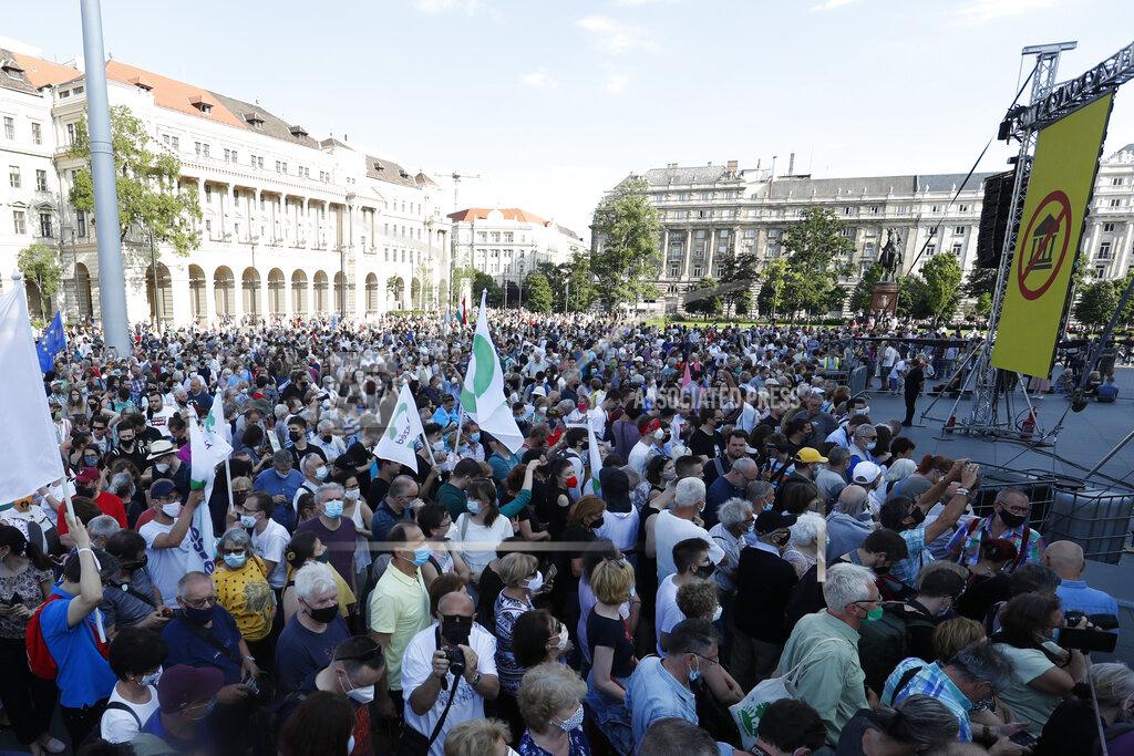 Laszlo Balogh Protesters gather in downtown Budapest, Hungary, Saturday, June 5, 2021. Thousands of people gathered opposing the Hungarian government's plan of building a campus for China's Fudan University in Budapest. (AP Photo/Laszlo Balogh)