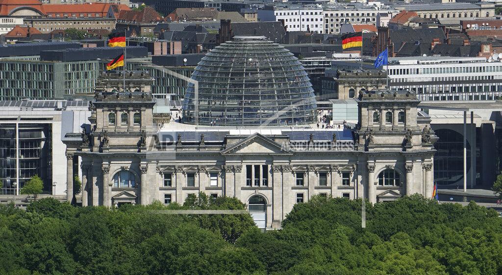 Michael Sohn In this Tuesday, May 8, 2018 photo the Reichstag Building, host of the German federal parliament, is photographed in Berlin, Germany. German voters elect a new parliament on Sunday, Sept. 26, 2021, a vote that will determine who succeeds Chancellor Angela Merkel after her 16 years in power. (AP Photo/Michael Sohn)